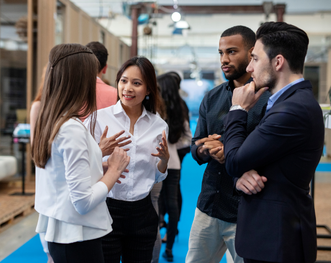 Group of two men and two women talking.